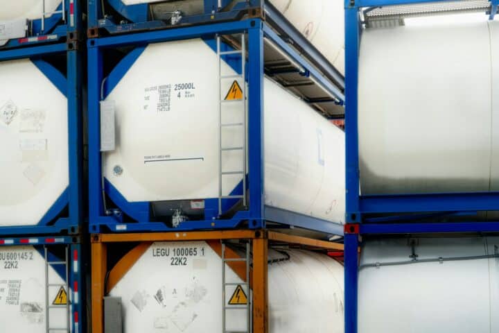 Chemical tank container. ISO tank container for chemical delivery. Bulk liquid transport. Chemical